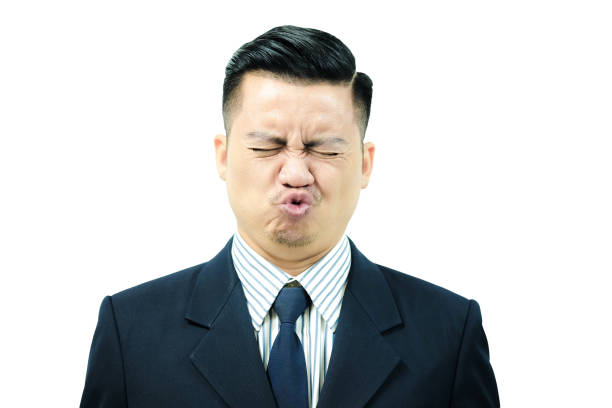 Asian men are exercising facial muscles, pucker up and eyes closed Asian men are exercising facial muscles, pucker up and eyes closed sour face stock pictures, royalty-free photos & images