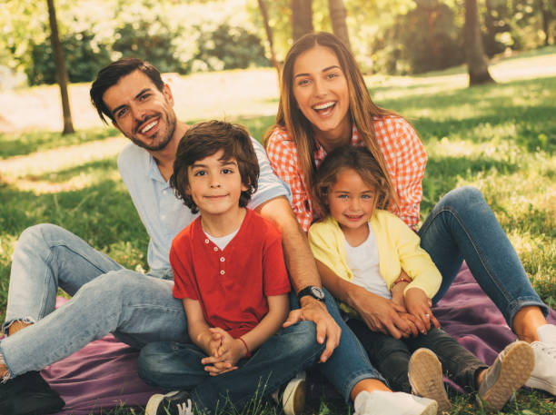 istock Young family in the park 696183484