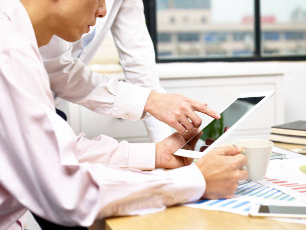 istock corporate executives discussing business in office 696183552