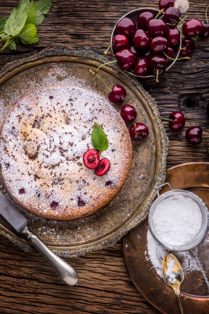 istock Cherry Cake. Assortment ingredients and cherry cake in retro style 696190940