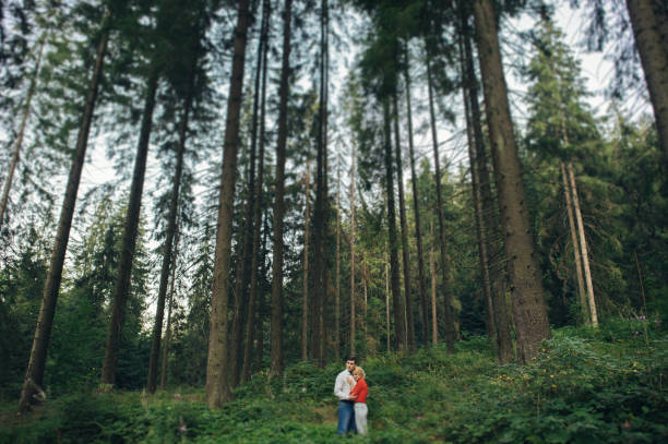 istock Happy  couple posing in the forest 696191640