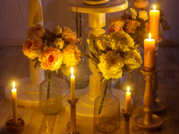 istock Burning Candles And Flowers 696197628