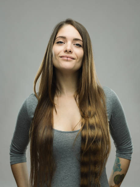 istock Real happy young woman studio portrait 696198252
