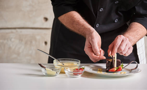 istock Restaurant hotel private chef preparing desert chocolate cake 696198440