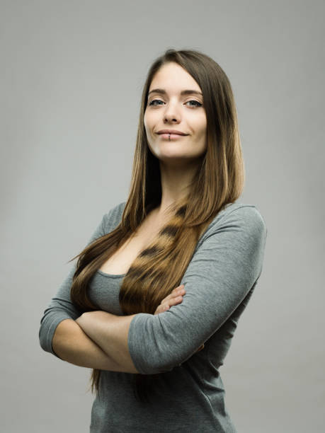 Confident real young woman studio portrait