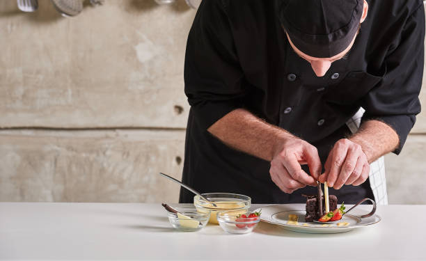 istock Restaurant hotel private chef preparing desert chocolate cake 696198742