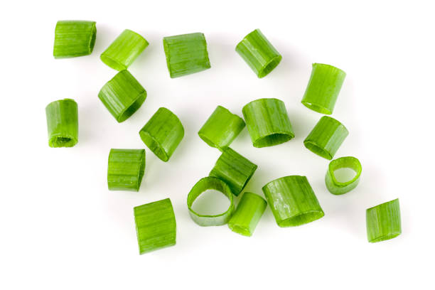 istock Chopped fresh green onions isolated on white background. Top view 696202180