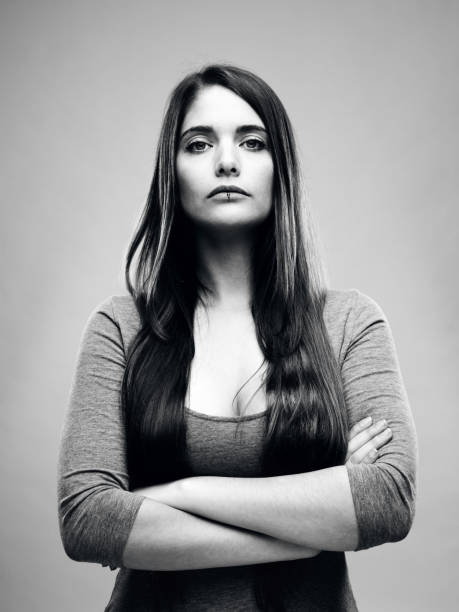 istock Real young woman black and white studio portrait 696202852