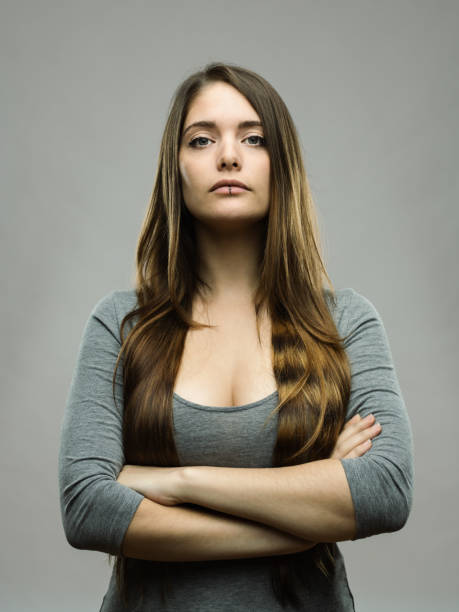 istock Real young woman studio portrait 696202890