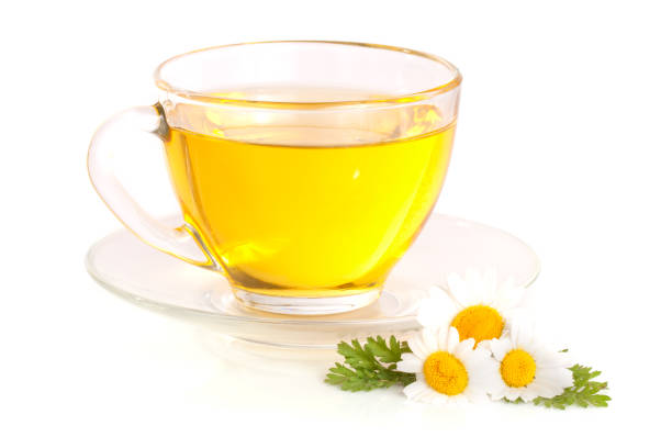 istock Herbal tea with fresh chamomile flowers isolated on white background 696205416