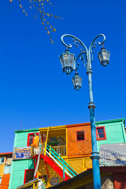 Streetlight with the colorful houses in Caminito in La Boca district, Buenos Aires city, Argentina. Caminito, a traditional alley, of great cultural and tourism, in the district of La Boca in Buenos Aires, Argentina. caminito stock pictures, royalty-free photos & images