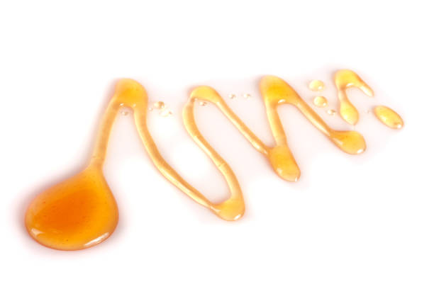 istock Honey stain isolated on a white background 696209016
