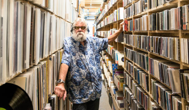 istock Record collector in front of his collection 696209268