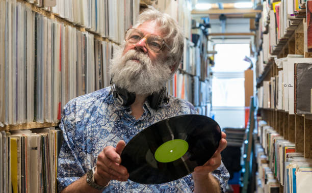 istock Record collector in front of his collection 696209280