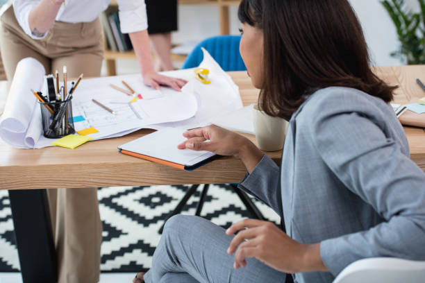 istock Young african american businesswoman sitting at table and using digital tablet 696211376