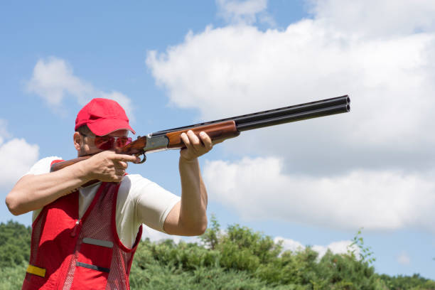 istock Man shooting skeet with a shotgun 696220376