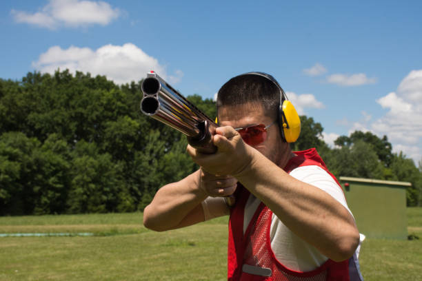 istock Man shooting skeet with a shotgun 696220806