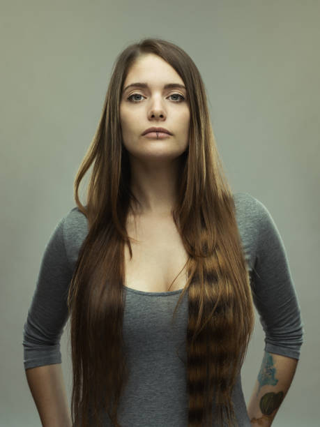 istock Real young woman studio portrait 696220940