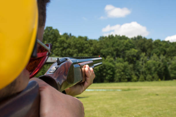 istock Man shooting on an outdoor shooting range 696220942