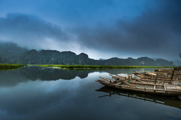 Early morning on Van Long lagoon with many fog