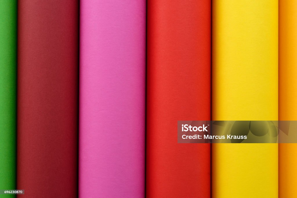 Rolls of colored paper in green, brown, pink, red yellow and orange Colored paper in green, brown, pink, red yellow and orange Abstract Stock Photo