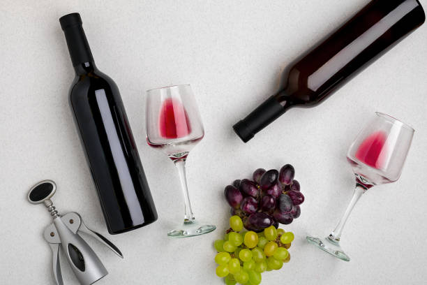 istock Two glasses of red wine and grapes. Top view 696235214