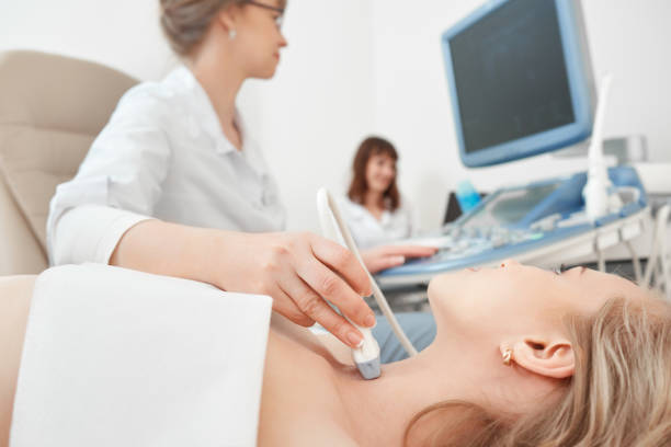 Young woman getting ultrasound scanning examination at the hospi stock photo