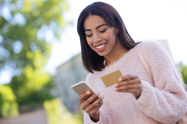 istock Confident gorgeous woman paying for her purchase 696237036