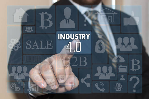 istock Businessman pushes a button INDUSTRY 4.0 on the touch screen with metro style graphic user interface. 696243494