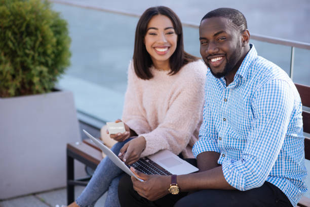 istock Sweet positive couple deciding making an online purchase 696246126