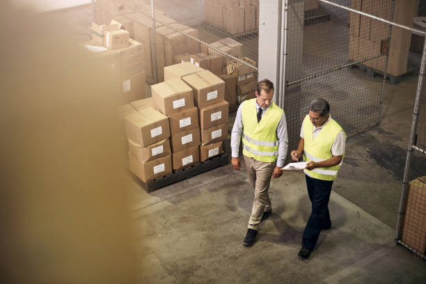 istock Supervising the factory unit together 696247508