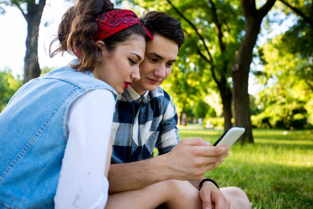 istock Beautiful couple taking a selfie on a picnic 696247694
