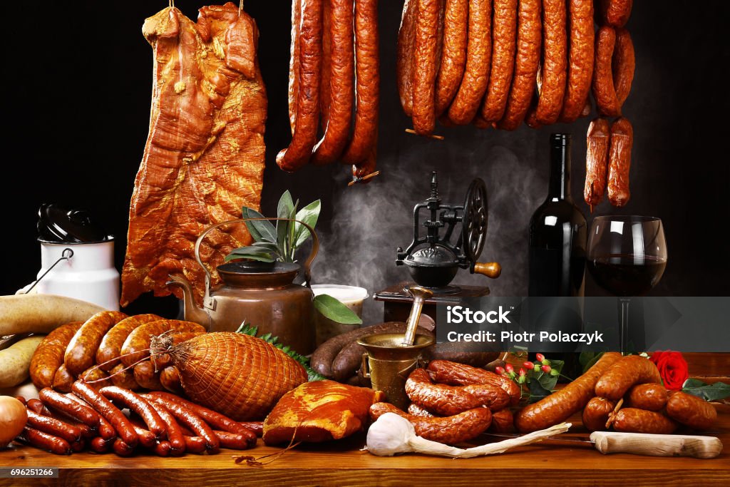 Country table with meat and wine Country table with meat and wine on black background with smoke Alcohol - Drink Stock Photo