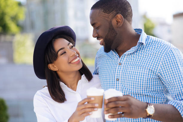 istock Energetic romantic couple having some coffee to go 696252048