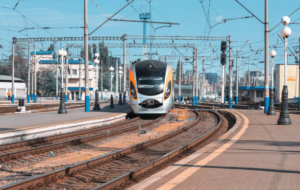 istock Beautiful train arrives on the railway station at sunset 696254618