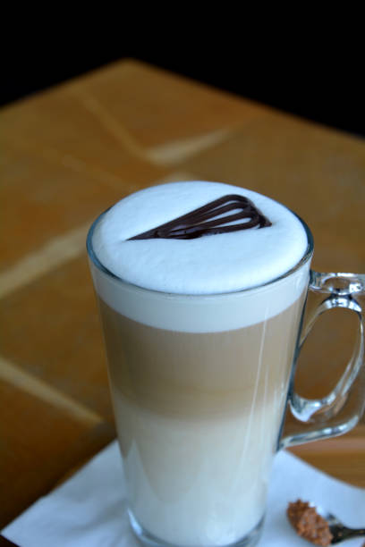 istock Latte Macchiato On Glass Cup On A Wooden Table 696257200
