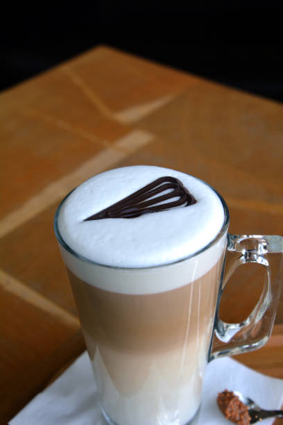 istock Latte Macchiato On Glass Cup On A Wooden Table 696257436