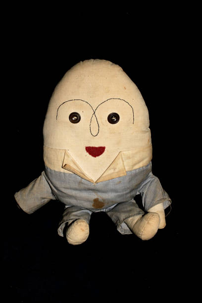 istock Humpty Dumpty Vintage Toy on Black Background 696258966
