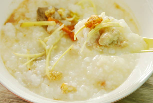 istock boiled rice with chop pork and slice ginger on spoon 696259218