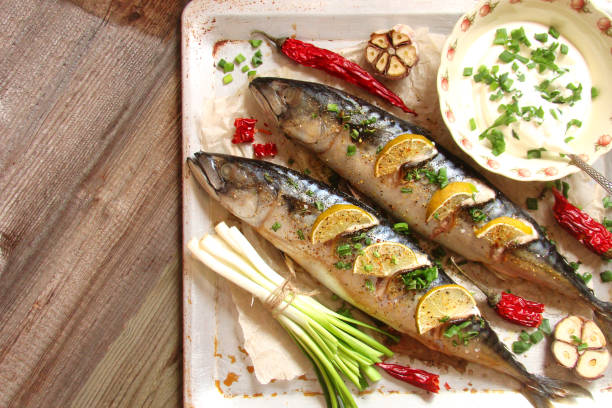 istock Fish baked with lime, peppers and spices 696261444