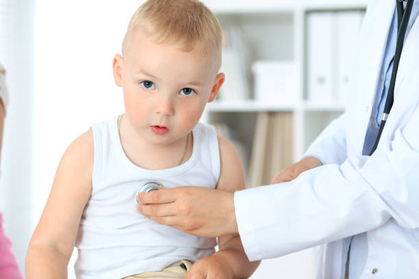 istock Doctor examining a child  patient by stethoscope 696265736