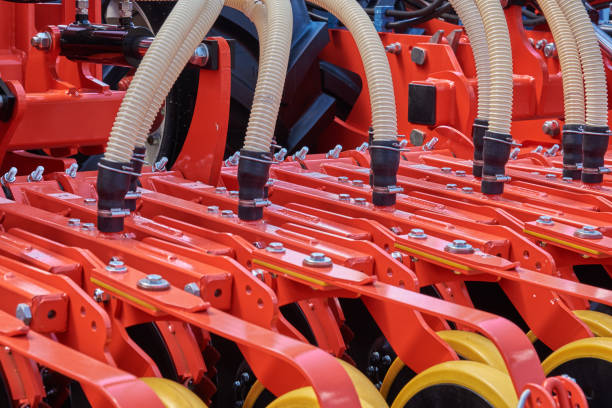 istock Fragment of a seeder with grain feeding hoses 696272514