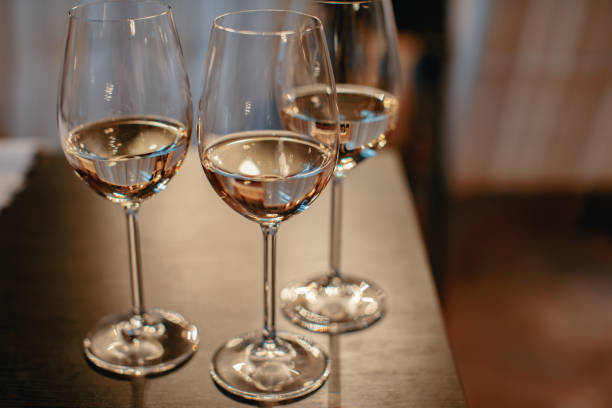 istock Row of glasses with white wines prepared for tasting 696278262