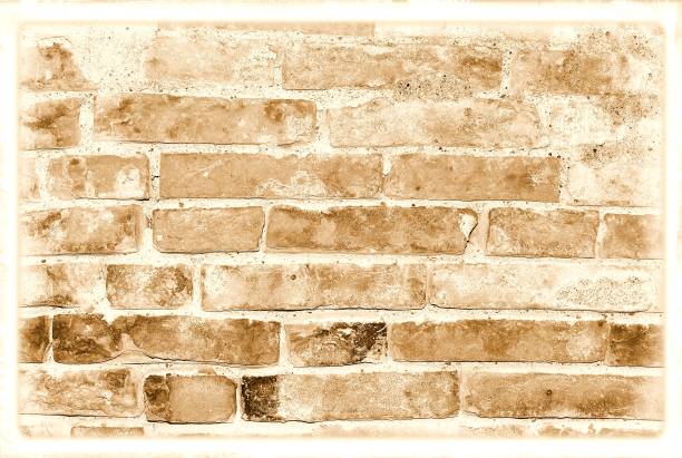 istock Old damaged brick wall in sepia tones for texture or background. 696284888