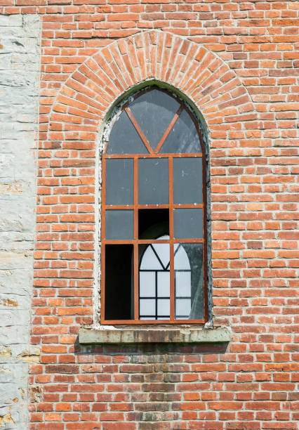 istock Old broken window in the abandoned church 696288736