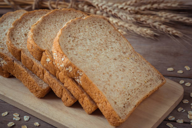 istock Whole wheat bread on wooden plate 696289656