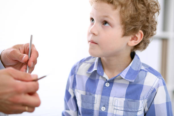 istock Doctor examining a child  patient by stethoscope 696296256