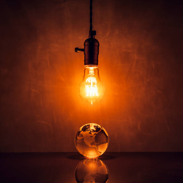 istock Light bulb and world globe on blackboard - Vintage Earth Grunge 696296754
