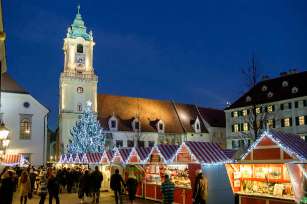 Bratislava at Christmas, the Hlavné námestie (Main Square)-Slovakia Tourists and locals in the Hlavné námestie - Main Square - one of the best known squares in Bratislava, where every year a traditional Christmas Market is held. bratislava photos stock pictures, royalty-free photos & images