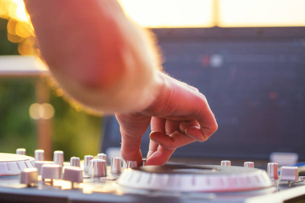 istock Dj mixing music outdoor. 696303994